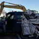 Illustration for article titled Highway Thieves in Italy Block Police With Burning Trucks, Peel Open Van With Backhoe, Get Away With $2.6 Million